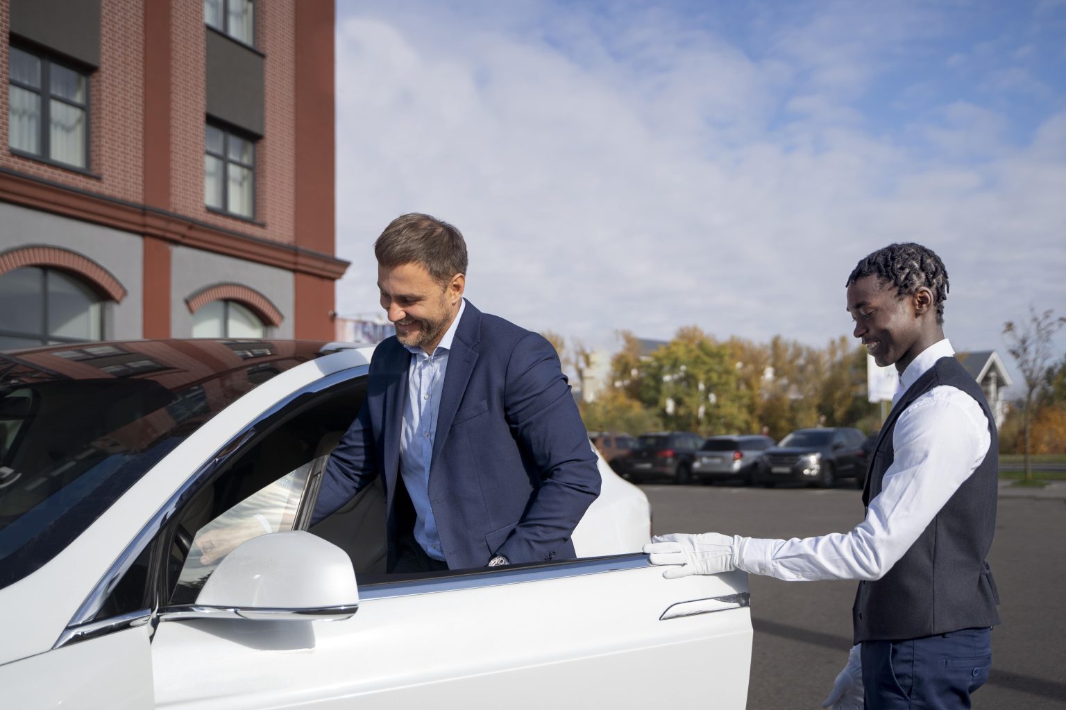 Professional Pickup at Your Location valet-helping-man-side-view-min