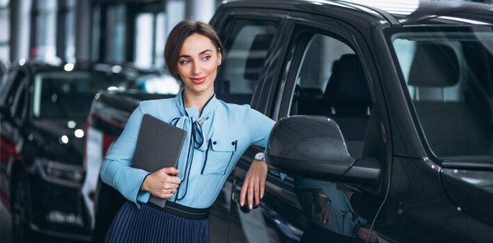 female-salesperson-car-showroom