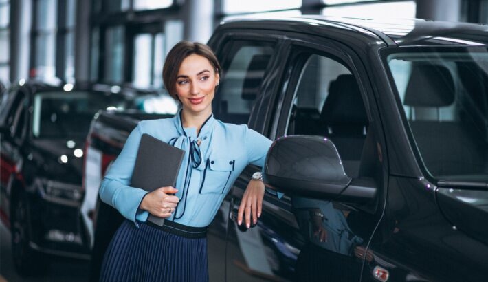 female-salesperson-car-showroom