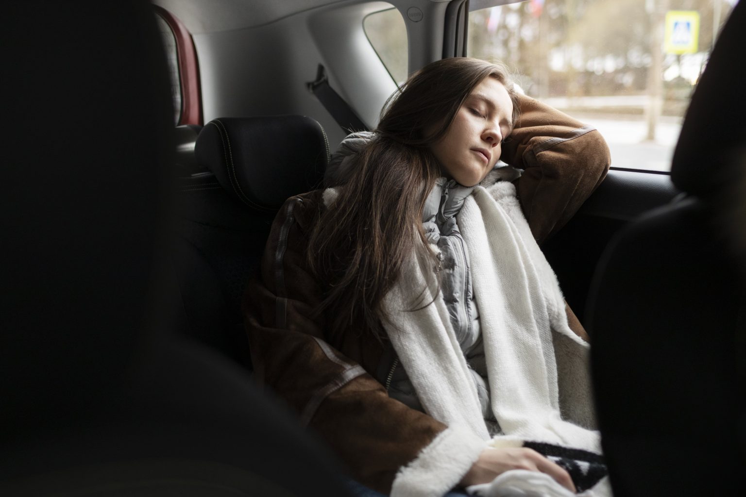 woman-resting-car-while-winter-road-trip-min-1536x1024 woman-resting-car-while-winter-road-trip-min-1536x1024